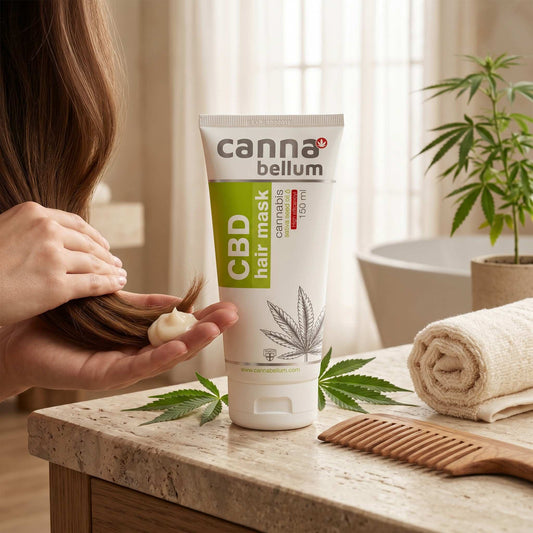 Masque capillaire CBD Cannabellum en tube, près d’un peigne et d’une serviette
