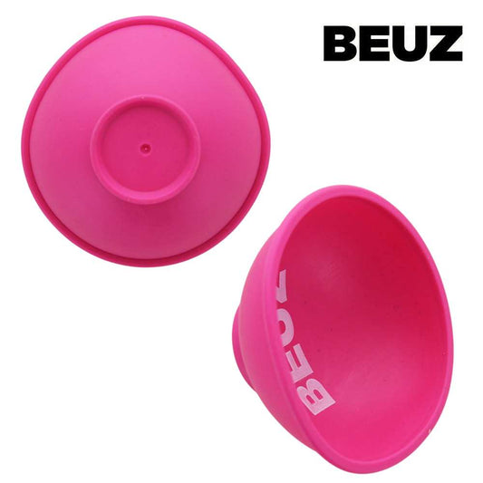 Bol à mix en silicone rose BEUZ, dessous avec disque et point central.